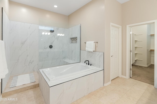 full bathroom with a garden tub, a walk in shower, tile patterned flooring, recessed lighting, and baseboards