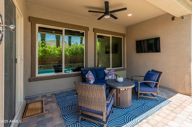 view of patio featuring ceiling fan