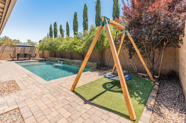 view of swimming pool featuring a patio area and a fenced backyard