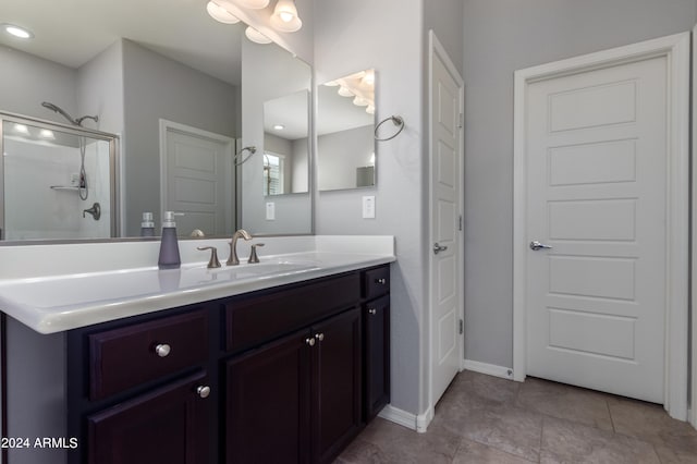 bathroom with vanity and tile flooring