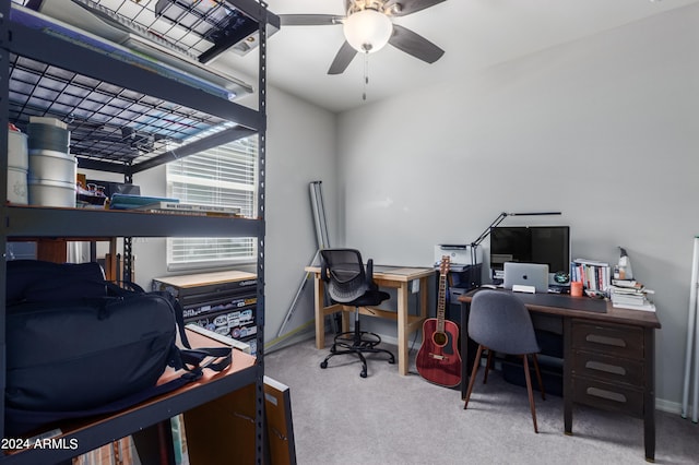 carpeted office featuring ceiling fan