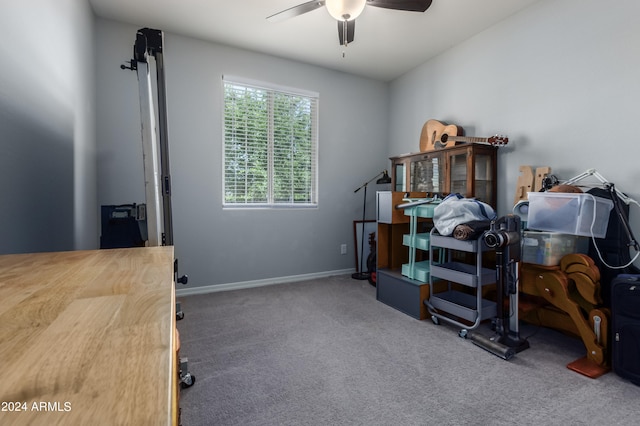 home office featuring ceiling fan and carpet flooring