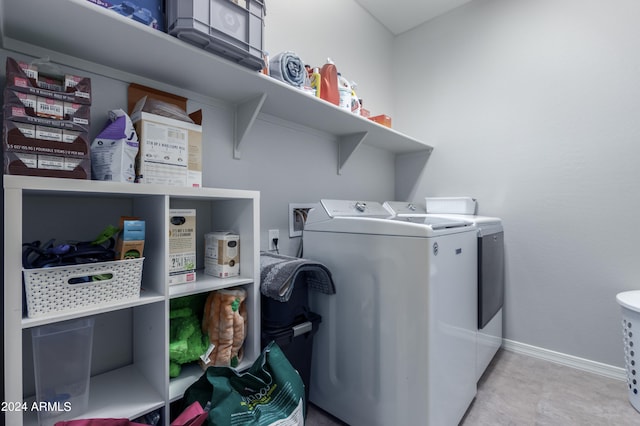 laundry room featuring tile floors, washer hookup, and washer and clothes dryer