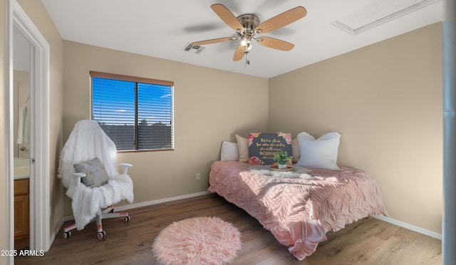 bedroom with visible vents, ceiling fan, baseboards, and wood finished floors