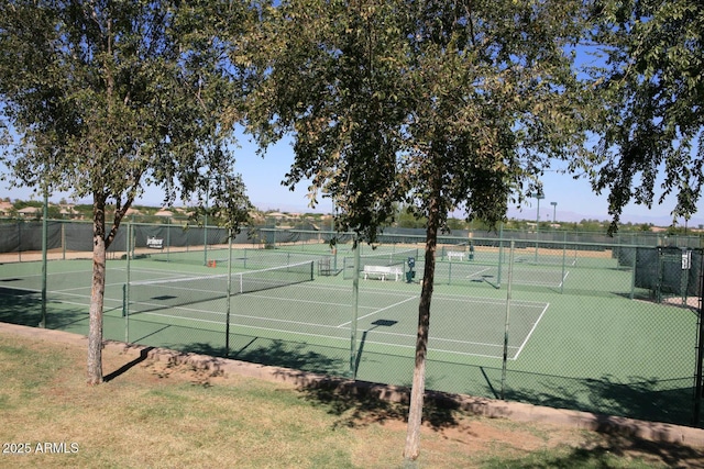 view of tennis court featuring fence