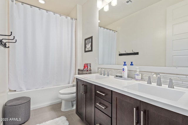 full bathroom with tile patterned floors, toilet, decorative backsplash, shower / bath combo with shower curtain, and vanity