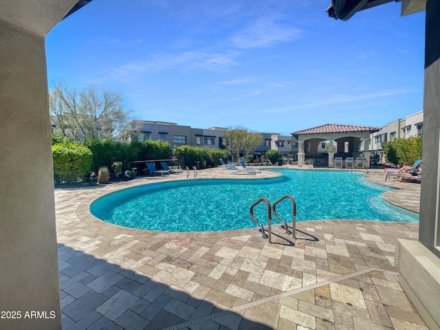 view of swimming pool featuring a patio area