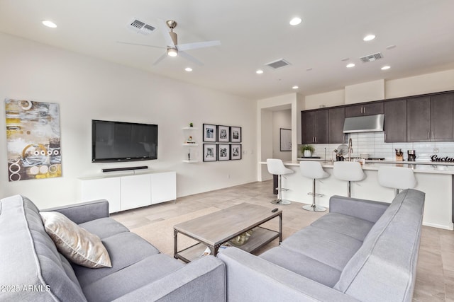 living room featuring ceiling fan