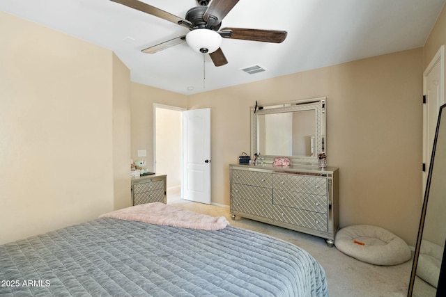 bedroom with ceiling fan and light colored carpet