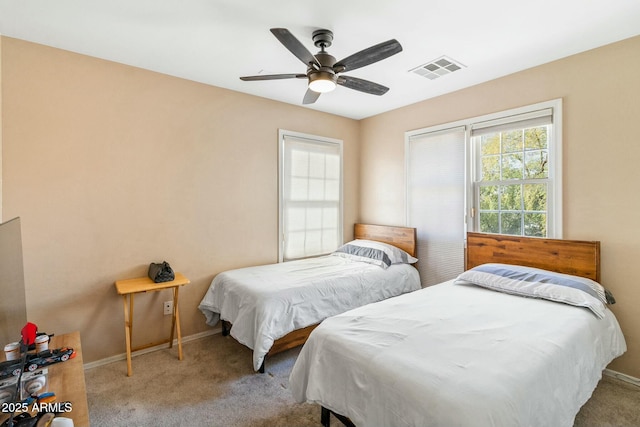 bedroom featuring ceiling fan and light colored carpet