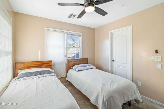 carpeted bedroom featuring ceiling fan