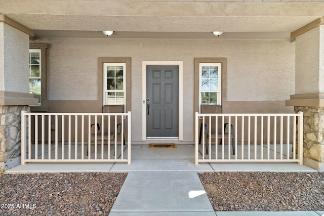 property entrance with covered porch