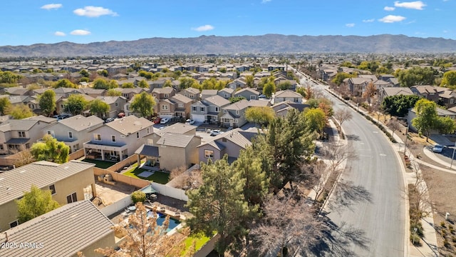 birds eye view of property with a mountain view