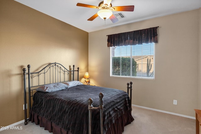 bedroom with visible vents, carpet floors, and baseboards