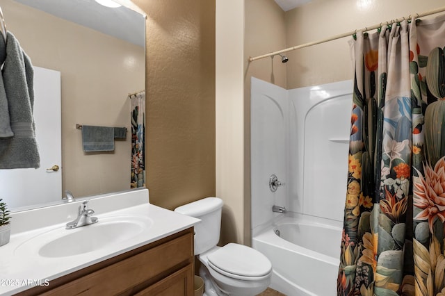 full bath featuring vanity, toilet, and shower / tub combo