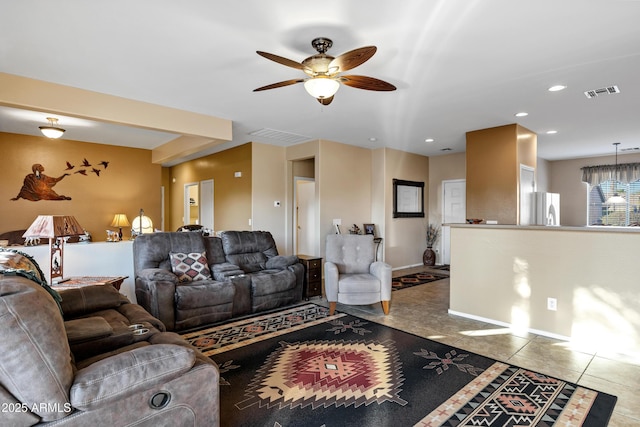 living area featuring tile patterned floors, visible vents, recessed lighting, and a ceiling fan