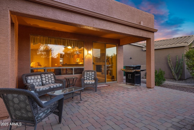 patio terrace at dusk with area for grilling