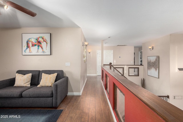 corridor with dark hardwood / wood-style flooring