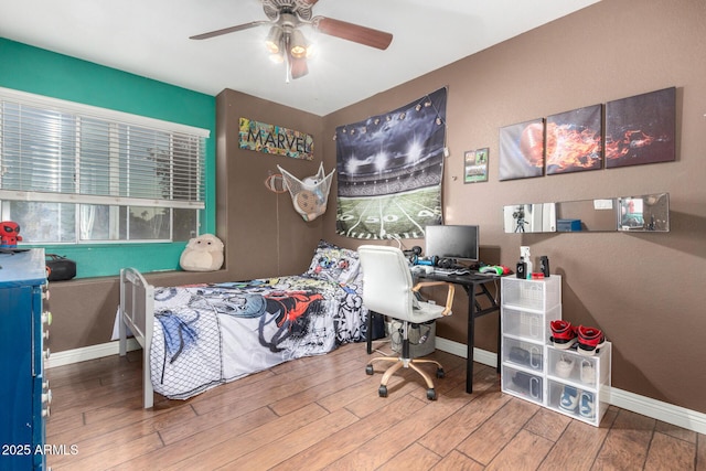 bedroom with wood-type flooring and ceiling fan