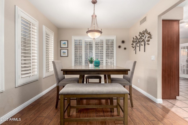 dining room with wood-type flooring