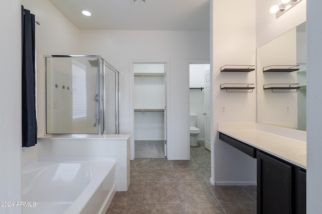 full bathroom featuring tile patterned flooring, vanity, independent shower and bath, and toilet