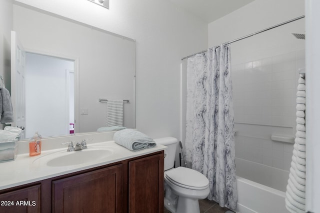 full bathroom featuring vanity, toilet, and shower / tub combo