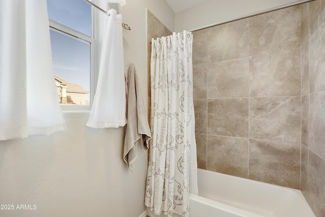 bathroom featuring shower / bath combo with shower curtain