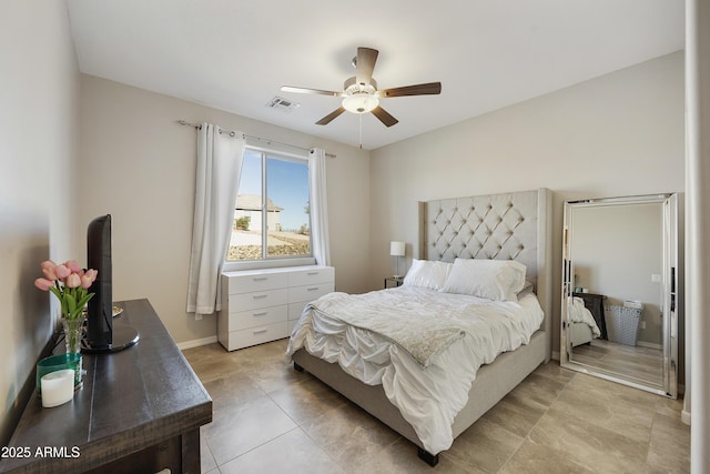 bedroom featuring baseboards, visible vents, and a ceiling fan