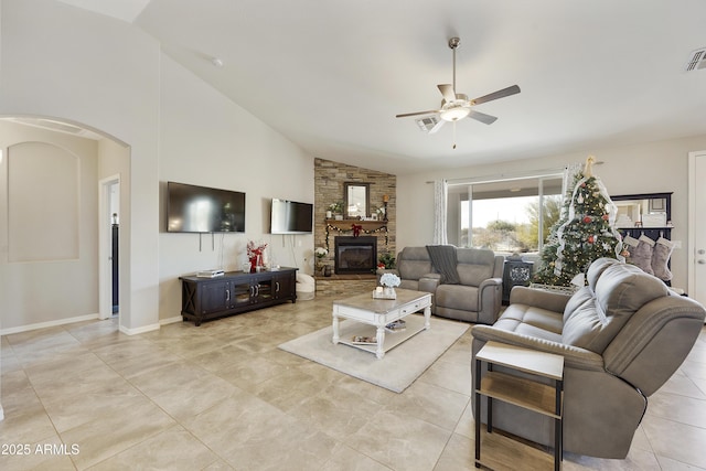 living room featuring arched walkways, high vaulted ceiling, a fireplace, visible vents, and a ceiling fan