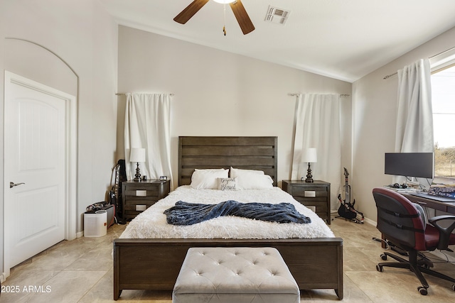 bedroom with lofted ceiling, light tile patterned floors, visible vents, baseboards, and a ceiling fan