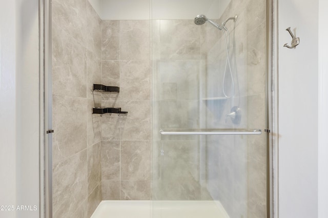 bathroom with tiled shower