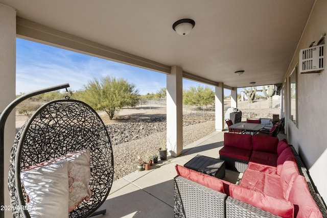 view of patio with fence and an outdoor hangout area