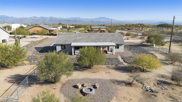 birds eye view of property with a mountain view