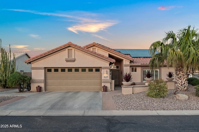 4029 N 160th Dr, Goodyear, AZ 85395 - ranch-style home with stucco siding, a tile roof, roof mounted solar panels, concrete driveway, and a garage