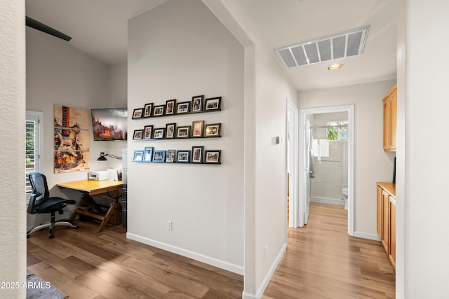 4029 N 160th Dr, Goodyear, AZ 85395 - hallway with light wood-type flooring and an office area