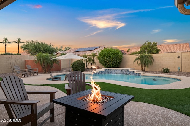 4029 N 160th Dr, Goodyear, AZ 85395 - view of swimming pool with an outdoor fire pit, a patio, and a fenced backyard