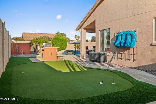 4029 N 160th Dr, Goodyear, AZ 85395 - fenced backyard with a putting green and a patio