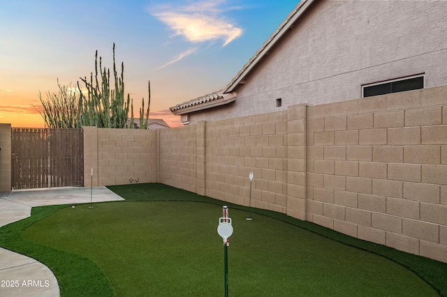 4029 N 160th Dr, Goodyear, AZ 85395 - yard at dusk featuring a putting green