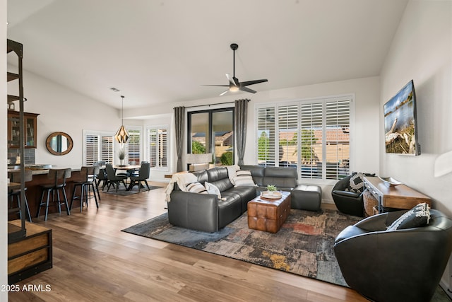 4029 N 160th Dr, Goodyear, AZ 85395 - living room with lofted ceiling, a ceiling fan, and wood finished floors