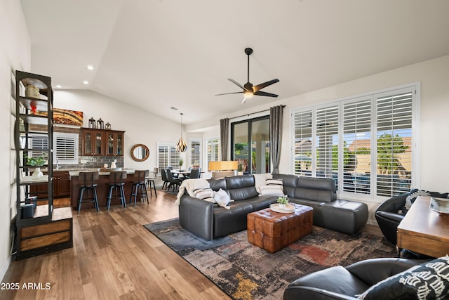 4029 N 160th Dr, Goodyear, AZ 85395 - living room with lofted ceiling, wood finished floors, a ceiling fan, and recessed lighting