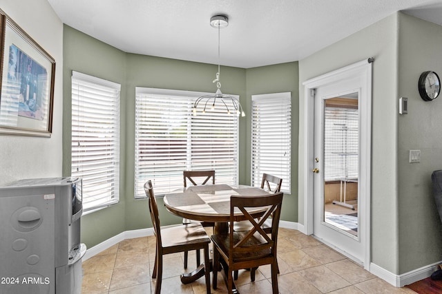 dining area with light tile patterned floors and plenty of natural light