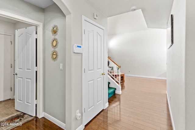 corridor featuring hardwood / wood-style floors