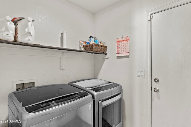 clothes washing area featuring washer and dryer