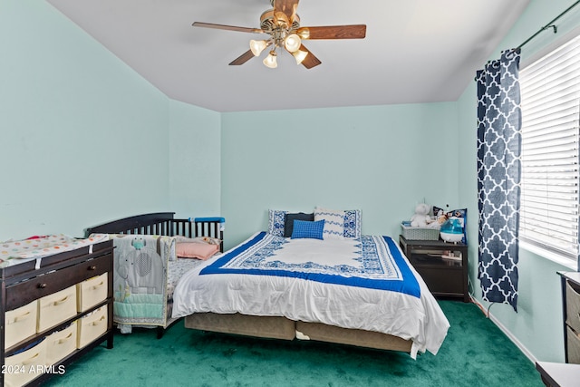 carpeted bedroom with ceiling fan