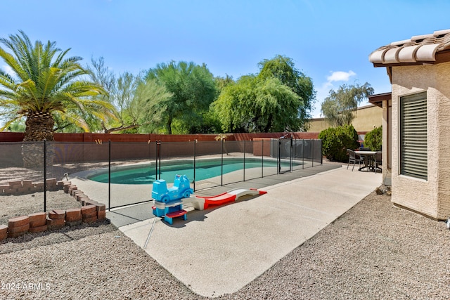 view of pool featuring a patio