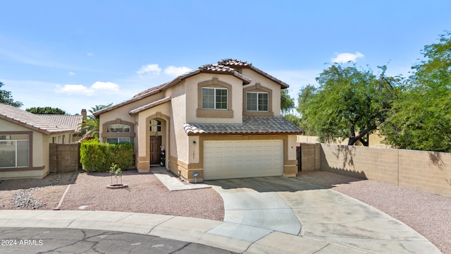 mediterranean / spanish-style house featuring a garage