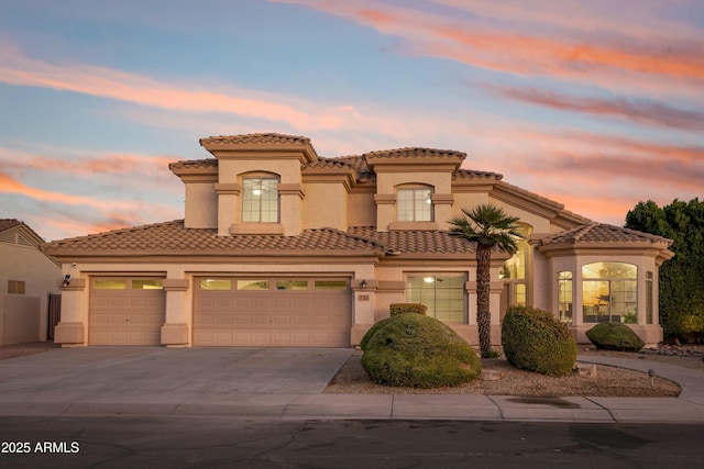 mediterranean / spanish-style home featuring a garage