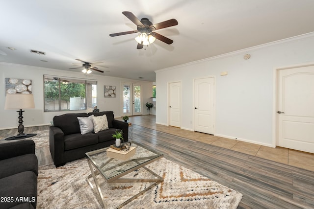 living room with ceiling fan, crown molding, and hardwood / wood-style floors