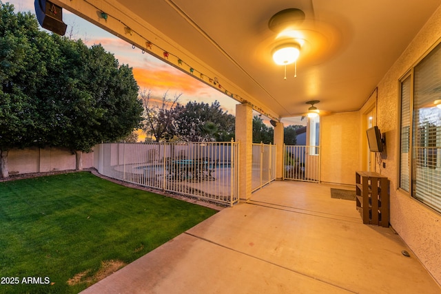 view of patio / terrace with a fenced in pool