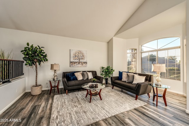 living room featuring hardwood / wood-style floors and lofted ceiling